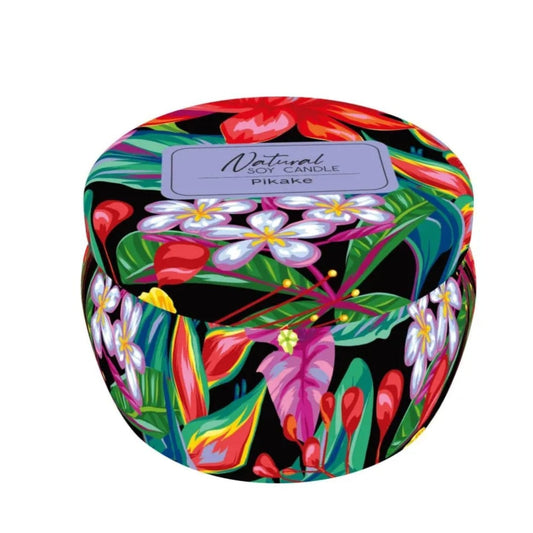 Colorful tropical-themed candle packaging on a white background